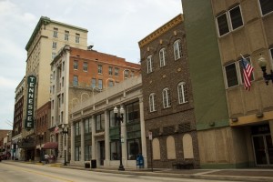 Photo shows the Burwell Building (building with Tennessee sign), the Mechanics Bank & Trust Company Building (with red entrance canopy) and next to it is the Knoxville Journal Arcade Building