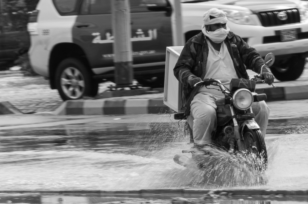 Photo Of The Week – Motorcycle in Ras al Khaimah UAE working its way through the flooded streets